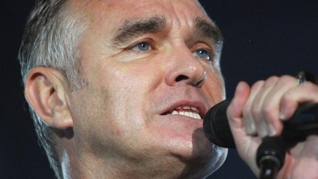 FILE - In this July 21, 2012 file photo, British rock singer Morrissey, the former front man of the alternative rock group The Smiths, sings during his concert in Tel Aviv, Israel. Animal rights activist and singer Morrissey said he's canceled an appearance Tuesday, Feb. 26, 2013, on Jimmy Kimmel's talk show because cast members of A&E's �Duck Dynasty� also were scheduled to appear. (AP Photo/Dan Balilty, File)