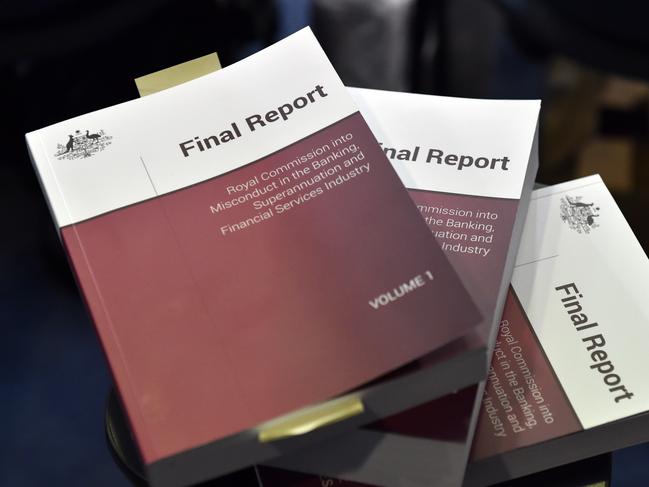 A copy of the report is seen at Treasurer Josh Frydenberg's press conference in response to the releasing of the Banking Royal Commission findings at Parliament House in Canberra, Monday, February 4, 2019. (AAP Image/Mick Tsikas) NO ARCHIVING