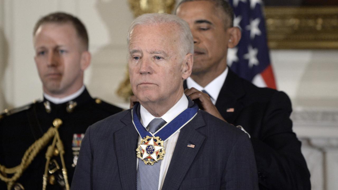 Barack Obama presents the Medal of Freedom to Joe Biden in 2017. Picture: Olivier Douliery-Pool/Getty Images