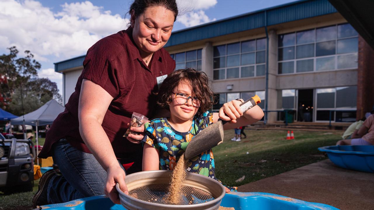 Chloe Clark and daughter Imogen Clark fossicking at Gemfest hosted by Toowoomba Lapidary Club at Centenary Heights State High School, Saturday, October 19, 2024. Picture: Kevin Farmer