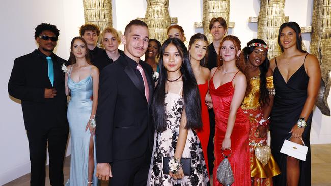 Melody Neal and her date Hunter Smith celebrate the end of Grade 12 with friends at the Peace Lutheran College formal evening at the Cairns Convention Centre. Picture: Brendan Radke