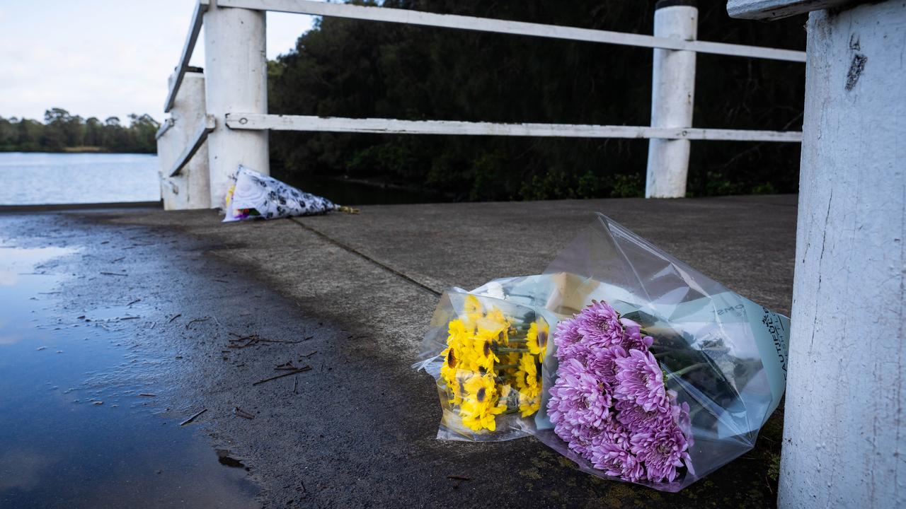 Floral tributes left on the jetty at Shearer Park in Lansvale. Picture: Tom Parrish