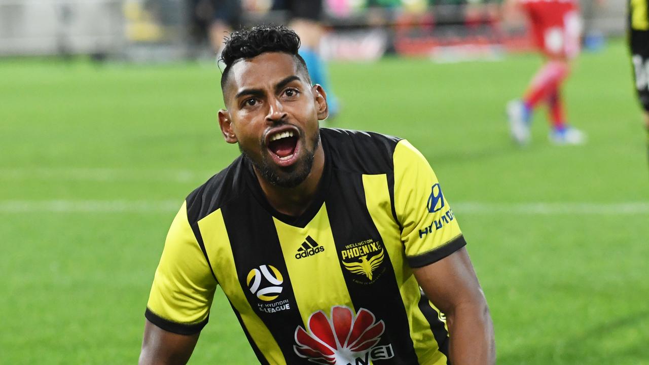 Roy Krishna of the Phoenix slides in after scoring against Melbourne City