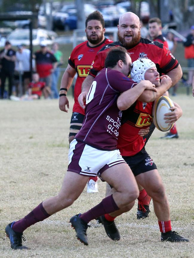 Uni vs. Hogs. Max Dempsey tackled. 12 August 2023 Ashmore Picture by Richard Gosling