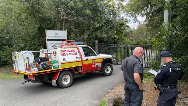 A fire investigator arrives at the scene of a blaze which destroyed a luxury day spa in the Sunshine Coast Hinterland.