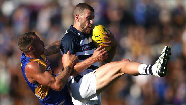 Sam Menegola juggles a mark against the Eagles.