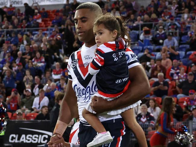 Michael Jennings of the Roosters walks onto the field with his children for his 300th match. Picture: Cameron Spencer/Getty Images