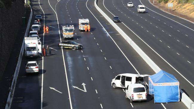 Mr Virgona’s white van (right) after the EastLink execution. Picture: David Crosling