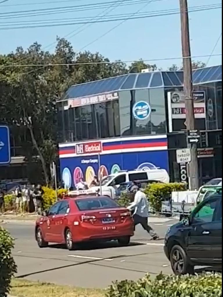 Vision stills show the moment a man carjacks a cab outside Fitness First in Sydney's Rockdale. The attacker later took his own life. Picture: Abbas Salim