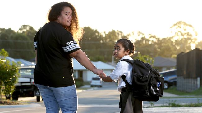 Wendy Taniela with Cyrus, showing how he had his hair up in a neat bun when at school.