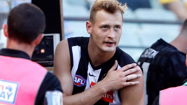 Nathan Kreuger leaves the field with an injured shoulder. Picture: AFL Photos via Getty Images