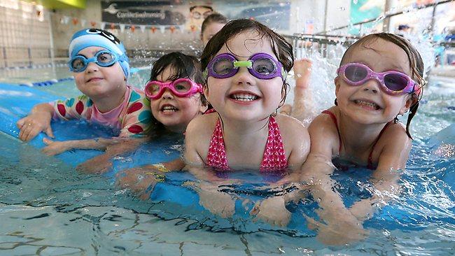 Toddlers swimming