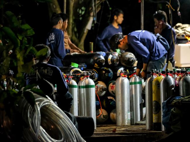 Diving cylinders are prepared at a makeshift camp at the entrance of Tham Luang Nang Non caves for the divers to continue the rescue operation. Picture: Getty