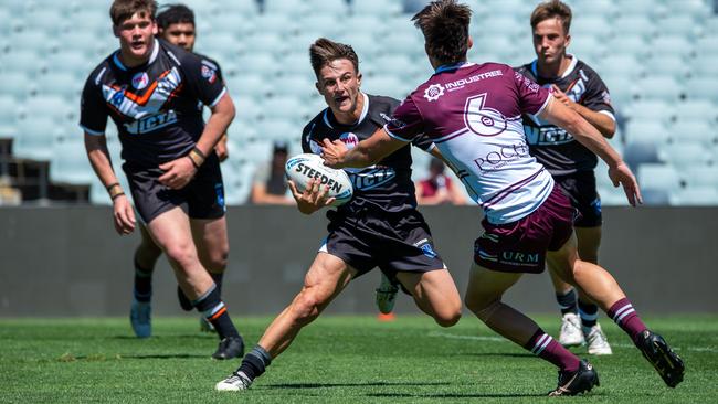 Wests’ Alex Isdale takes on the Manly defence last season in the Harold Matthews Cup. Picture: Thomas Lisson.