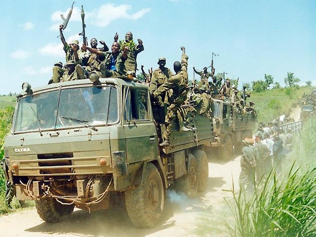 (FILES) In this file photograph taken on May 19, 2003, the last batch of soldiers with the Uganda People's Defense Force (UPDF) return through the town of Goli after withdrawing from the Democratic Republic of Congo's (DRC) embattled Ituri region. - The UN's top court on February 9, 2022, has ordered Uganda to pay the Democratic Republic of Congo $325 million in reparations over a brutal war two decades ago, just a fraction of the $11 billion demanded by Kinshasa. The ruling by the International Court of Justice (ICJ) is a blow to DR Congo after a long legal battle for compensation over the devastating 1998-2003 conflict that left thousands of people dead. (Photo by Peter BUSOMOKE / AFP)