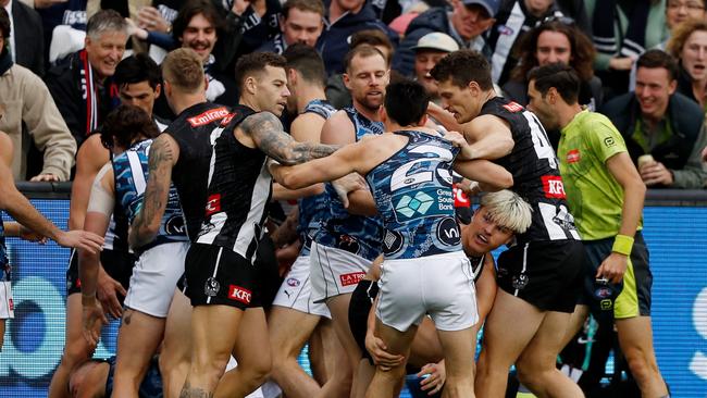 Players remonstrate contest between the arch enemies at the MCG.