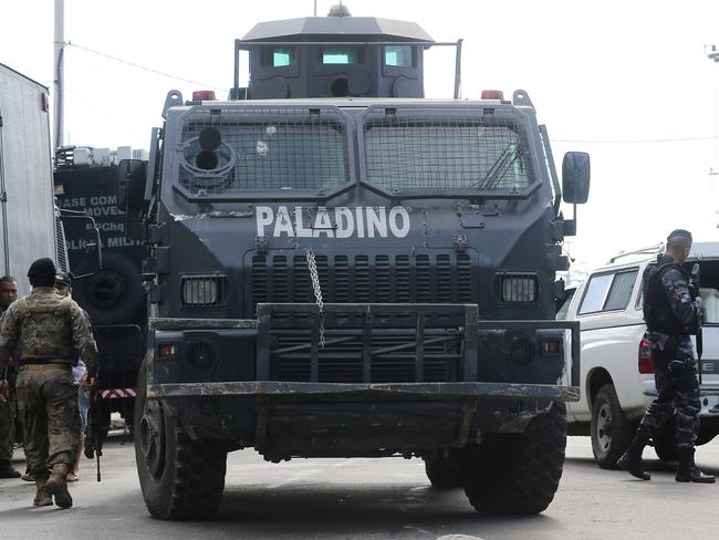 Military forces patrol along the Mare ‘favela’ community complex after National Force soldiers protecting Rio's Olympic Games were shot this week.