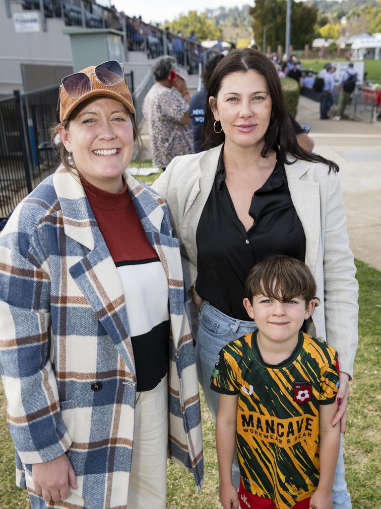 Amy Knights (left) and Emma Knights with Jax Brown supporting the St George Frillnecks . Picture: Kevin Farmer