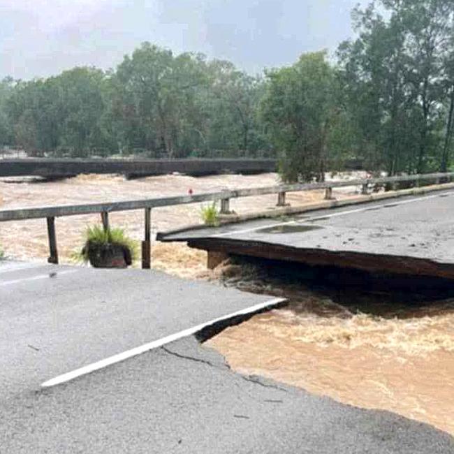 Ollera Creek Bridge cut in half from flood water on the Bruce Highway north of Townsville in February.