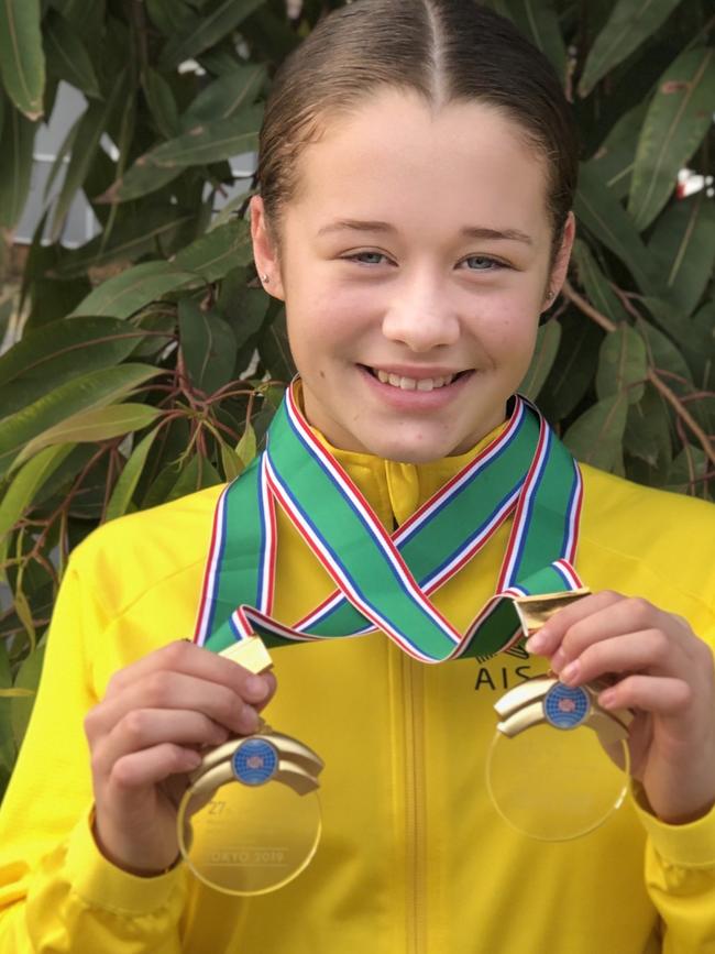 Young gymnast Koralee Catlett with her medals. Pic: Supplied.