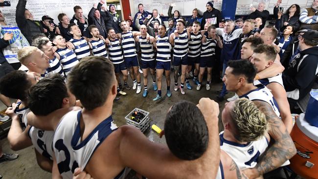 Chelsea sing the team song in the rooms after their win. Picture: Andrew Batsch