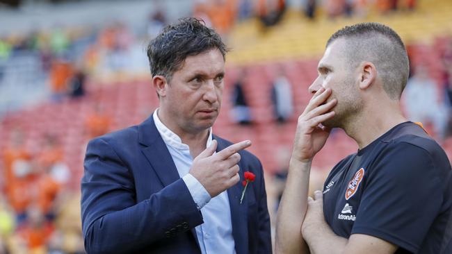 Departed Roar coach Robbie Fowler (left) talks tactics with Darren Davies. Picture: AAP Image/Glenn Hunt