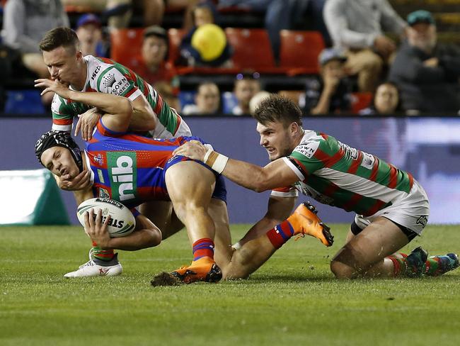 Kalyn Ponga of the Knights is tackled during the Round 9 NRL match between the Newcastle Knights and the South Sydney Rabbitohs at McDonald Jones Stadium in Newcastle, Friday, May 4, 2018. (AAP Image/Darren Pateman) NO ARCHIVING, EDITORIAL USE ONLY