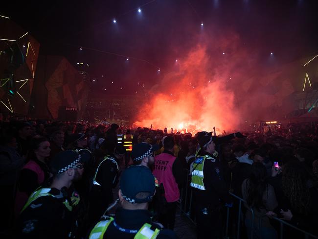 Police watch on. Picture: Jake Nowakowski