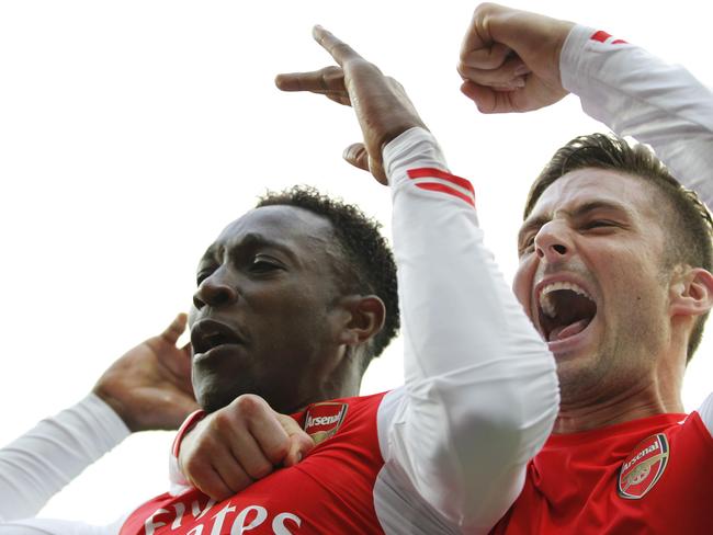 Arsenal's English striker Danny Welbeck (L) celebrates scoring his goal with Arsenal’s French striker Olivier Giroud after scoring the opening goal of the English Premier League football match between West Bromwich Albion and Arsenal at The Hawthorns in West Bromwich, central England on November 29, 2014. Arsenal won the game 1-0. AFP PHOTO / IAN KINGTON RESTRICTED TO EDITORIAL USE. No use with unauthorized audio, video, data, fixture lists, club/league logos or “live” services. Online in-match use limited to 45 images, no video emulation. No use in betting, games or single club/league/player publications.