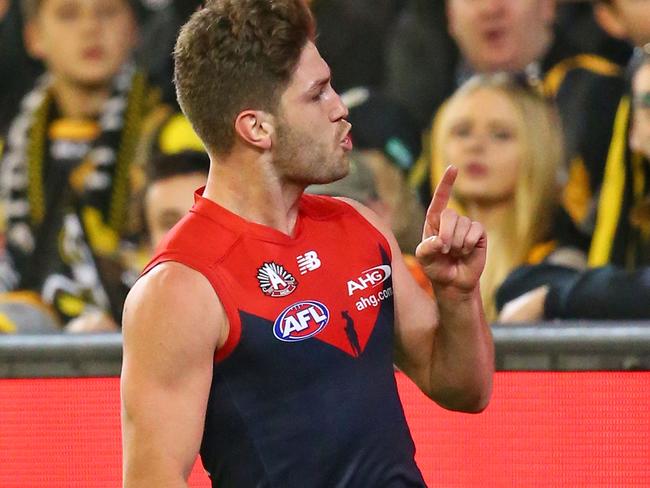 MELBOURNE, AUSTRALIA - APRIL 24:  Tomas Bugg of the Demons gestures to Tigers supporters in the crowd as he celebrates after kicking a goal during the round five AFL match between the Melbourne Demons and the Richmond Tigers at the Melbourne Cricket Ground on April 24, 2016 in Melbourne, Australia.  (Photo by Scott Barbour/AFL Media/Getty Images)