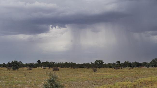 Storm clouds and rain on the outskirts of remote town of Bourke in north-west NSW. Picture: Elise Derwin