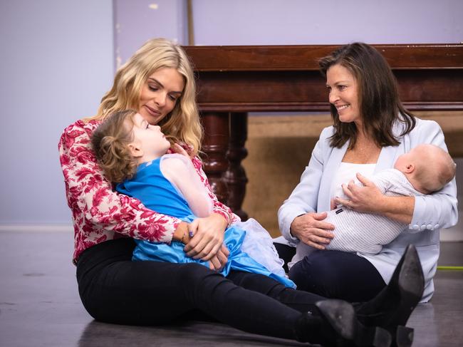 Molan and daughter Eliza with baby Herbert Robertson, son of Sebastian Robertson who is the founder of Batyr, a mental health organisation in Parramatta play with Jenny Morrison. Picture: Jason Edwards