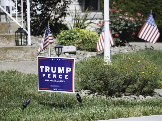 Trump/Pence campaign signs are seen in the front yard of a house in Old Forge. Picture: Angus Mordant for News Corp Australia