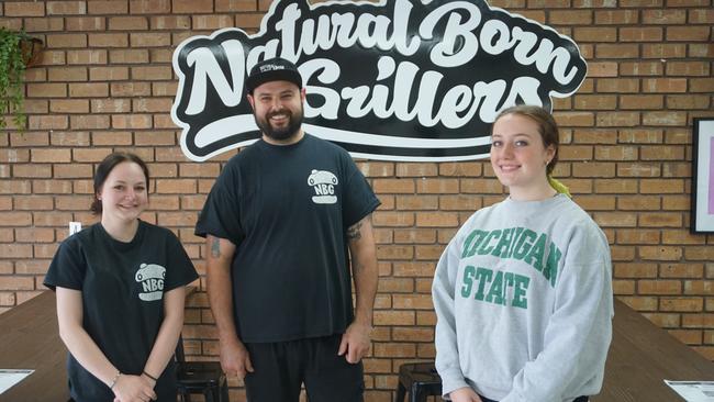 Natural Born Grillers owner Ben Hull, centre, with employees Tally Scullion and Edie Jones at the Mount Gambier burger shop. Picture: Jessica Ball