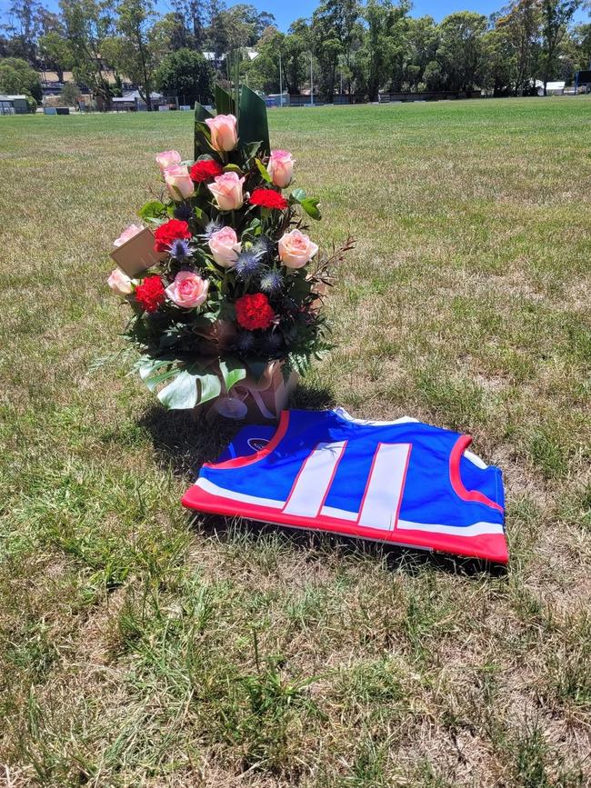 The Bunyip Football Club placed flowers next to Ash’s jersey he wore when playing. Picture: Facebook/Bunyip Football Club