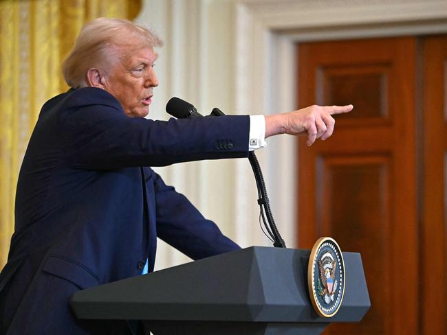 TOPSHOT - US President Donald Trump takes questions during a press conference with unseen Israel's Prime Minister Benjamin Netanyahu in the East Room of the White House in Washington, DC, on February 4, 2025. (Photo by ANDREW CABALLERO-REYNOLDS / AFP)