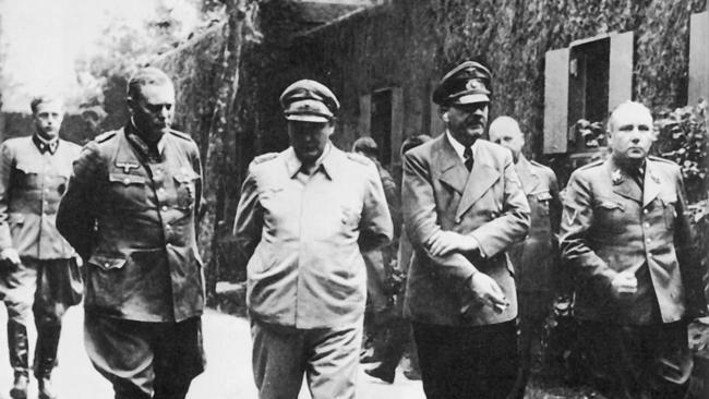 Adolf Hitler and Martin Bormann, far right, dispersed grants to universities taking a ‘balanced, realistic and responsible’ attitude to the Nazis.