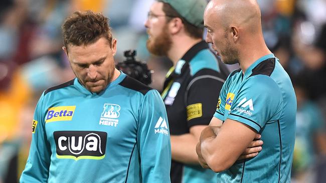Brendan McCullum and Chris Lynn after a disappointing end to Brisbane’s season. (AAP Image/Dave Hunt)