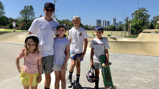 Blake Read with his children Lulu, 5, Lily Rose, 8, and Miller, 10, and their friend Levy at Meadowbank Skate Park. Picture: Nicole Pierre