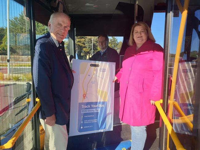 Transport Minister Eric Abetz, Metro driver Ryan McPherson and Metro CEO Katie Cooper announce real-time bus tracking.