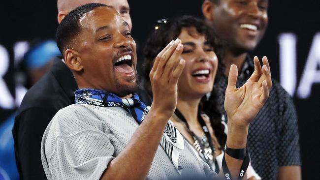 Will Smith cracks up as Jim Courier interviews Nick Kyrgios on court after the match.