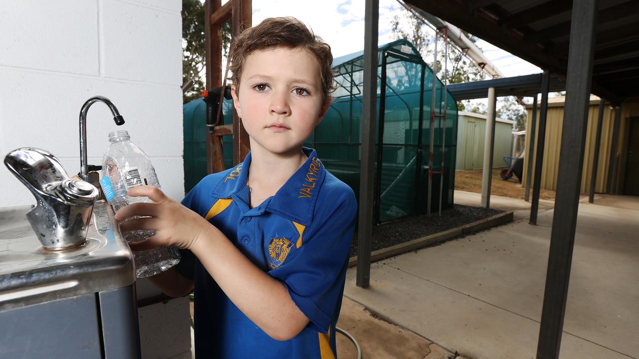 Year 1 student Ari Michelmore at the water bubbler at Valkyrie State School. Photo: Tara Croser.