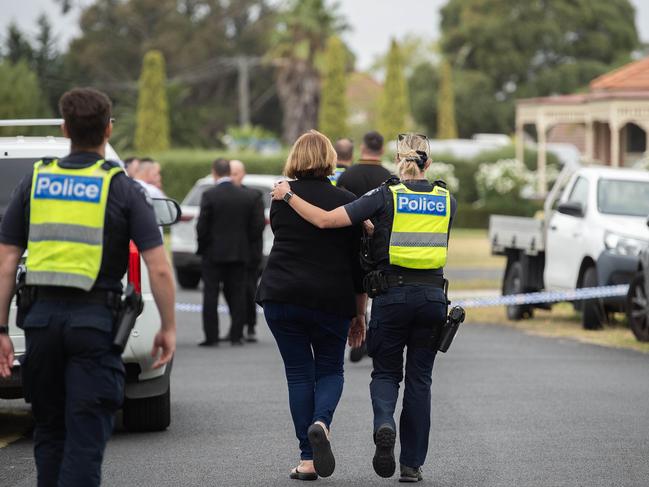 Police try to comfort family at the scene of the crime. Picture: Nicki Connolly