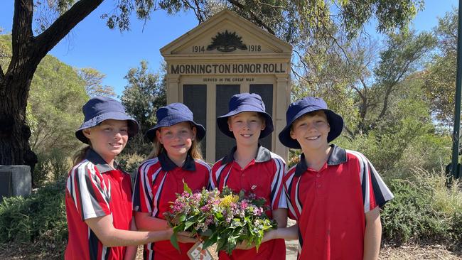 Mount Martha Primary School Year 5 students Jess, Heidi, Connor and PJ laid a wreath and the boys read In Flanders Fields during the service at Mornington Memorial Park. Picture: Lucy Callander