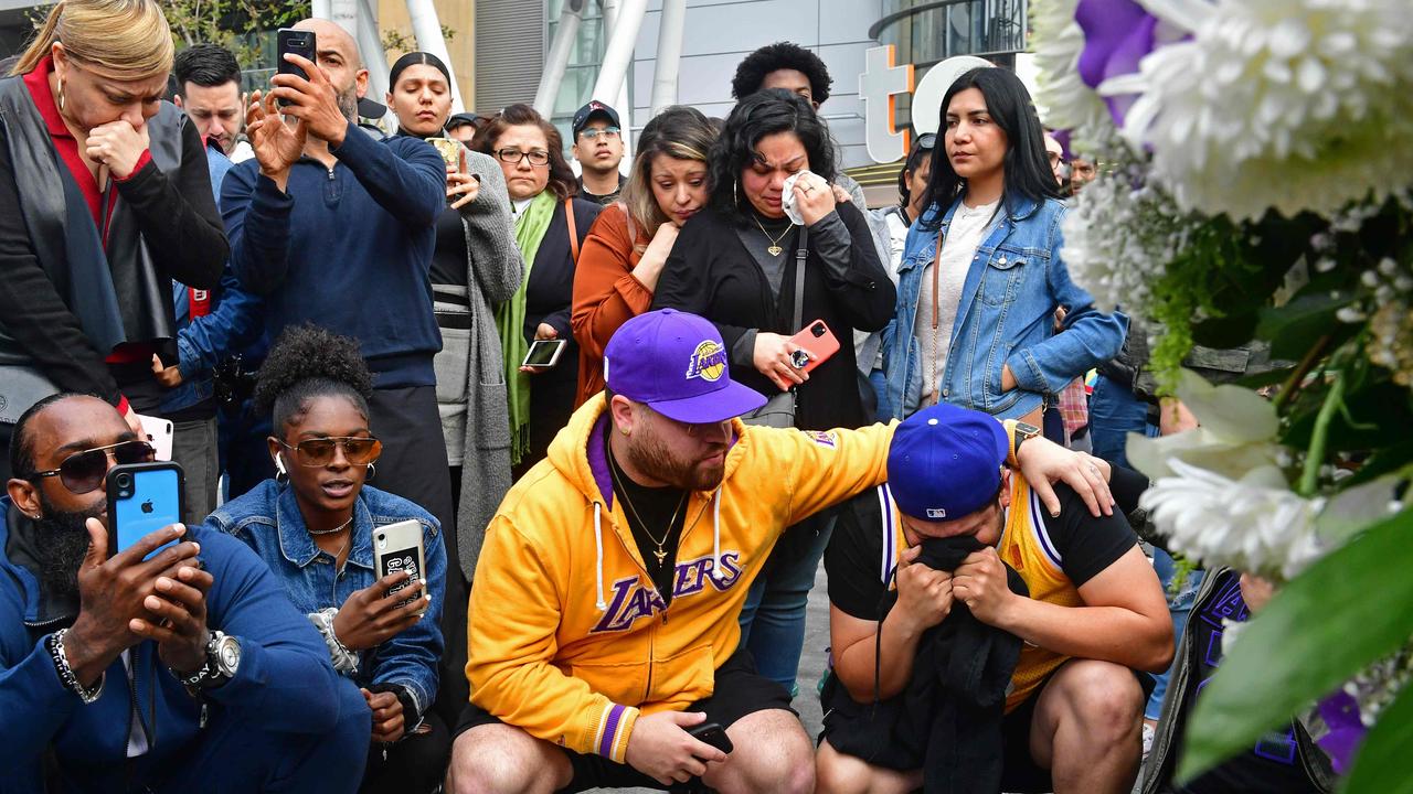 Kobe Bryant of the Los Angeles Lakers reacts after making a