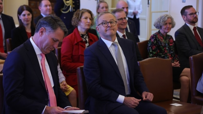 Anthony Albanese looks towards the media before he is sworn-in as Prime Minister in front of The Governor-General alongside Richard Marles. Picture: Getty Images.