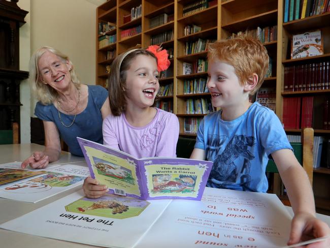 08/12/2017 Fitzroy Community School Head of English Faye Berryman with students Esther Howden, 6 and Cooper Gillies, 7Picture David Geraghty / The Australian.