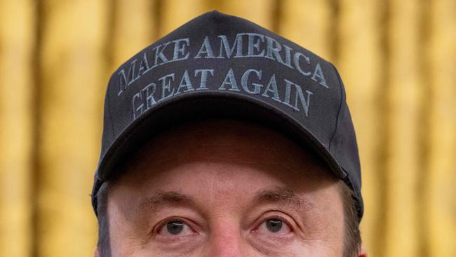 Tesla and SpaceX CEO Elon Musk looks on before US President Donald Trump signs executive orders in the Oval Office of the White House in Washington, DC, on February 11, 2025. (Photo by Jim WATSON / AFP)