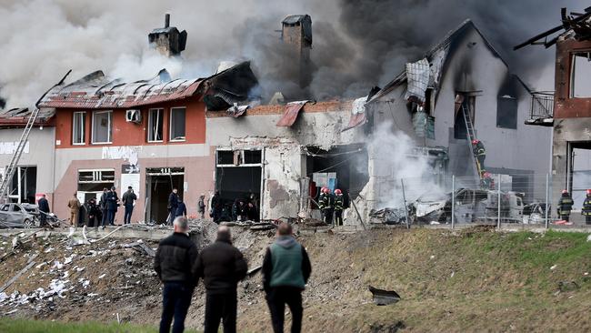 Firefighters battle a blaze after a civilian building was hit by a Russian missile in Lviv, Ukraine. Picture: Joe Raedle/Getty Images