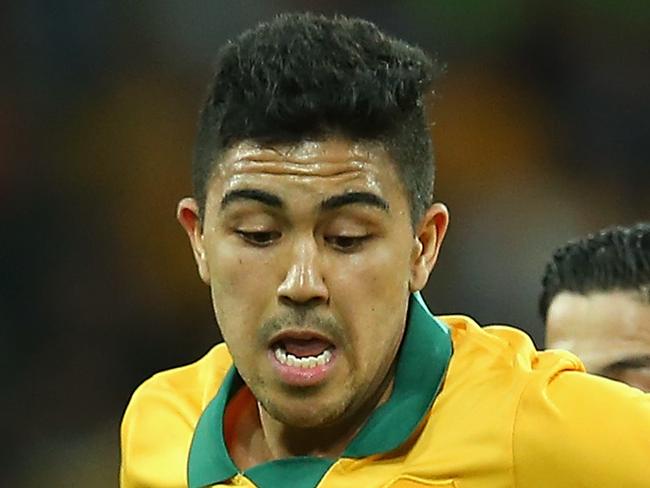 MELBOURNE, AUSTRALIA - JANUARY 09: Massimo Luongo of Australia is tackled by Sultan Alenezi of Kuwait during the 2015 Asian Cup match between the Australian Socceroos and Kuwait at AAMI Park on January 9, 2015 in Melbourne, Australia. (Photo by Quinn Rooney/Getty Images)